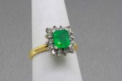 14k two tone Emerald and diamond Halo ring