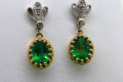 14k two toned emerald dangle earrings with diamonds