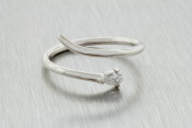 14k white gold free form ring with a diamond pear