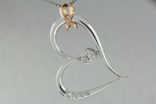 14k white and rose gold diamond heart pendant with breast cancer awareness ribbon