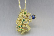 18k 3D Dragon Pendant with Green Diamond Eyes and Star Sapphire Planet