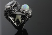 18k black gold opal and garnet ring with tooth