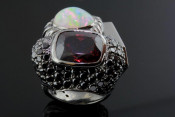 18k black gold opal and garnet ring with tooth
