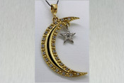 14k two toned moon and star pendant with diamonds