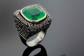 Emerald ring with black diamonds.